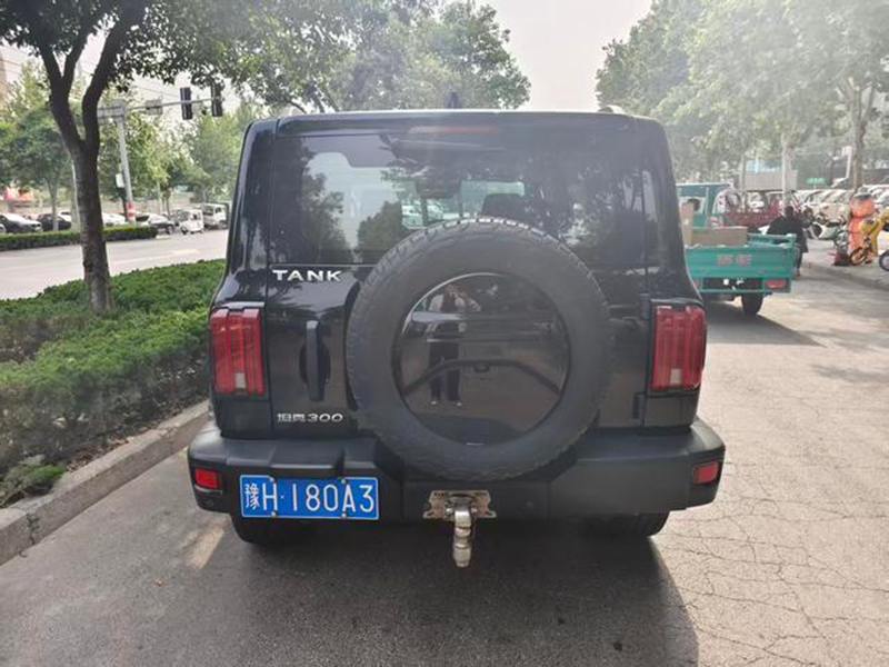 Representative black used GWM Tank 300 rear view with external spare wheel